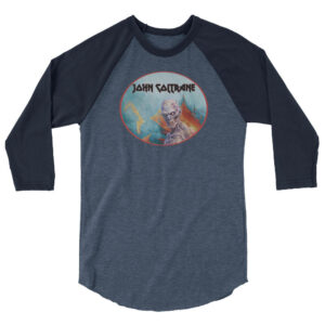 Front view of a navy blue and heathered raglan shirt printed with an oval horror-themed illustration of a zombie skull in a burning landscape, marked “John Coltrane.”
