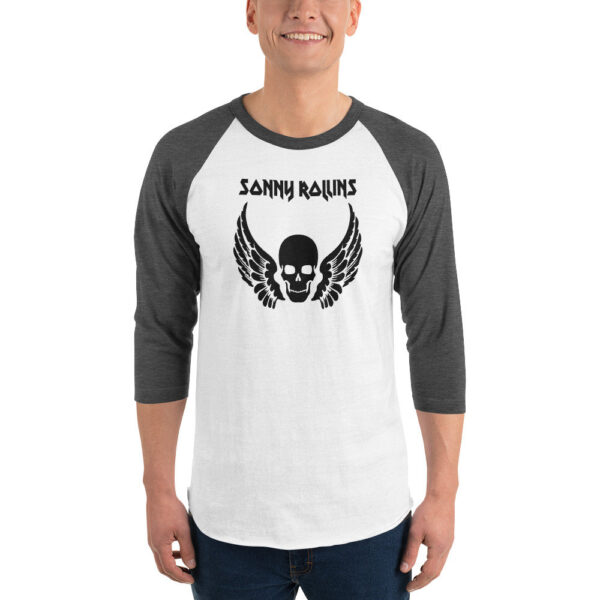 Dark gray and white raglan baseball shirt featuring a black print of a winged skull design and “Sonny Rollins” text in a heavy metal-style font.