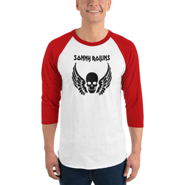 Red and white raglan baseball shirt with bold black graphic of a skull with outstretched wings and the name “Sonny Rollins” above in sharp, angular lettering.