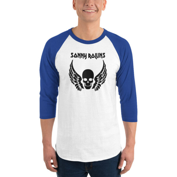 Three-quarter sleeve baseball tee with royal blue sleeves and white body, featuring a black skull with feathered wings and “Sonny Rollins” in a sharp, heavy-metal style font.