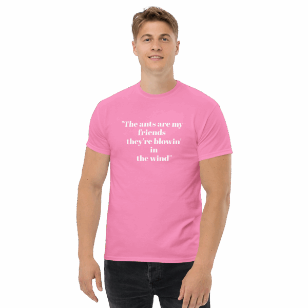 Man wearing a pink t-shirt with the phrase “The ants are my friends they’re blowin’ in the wind” printed in white, centered on the chest.