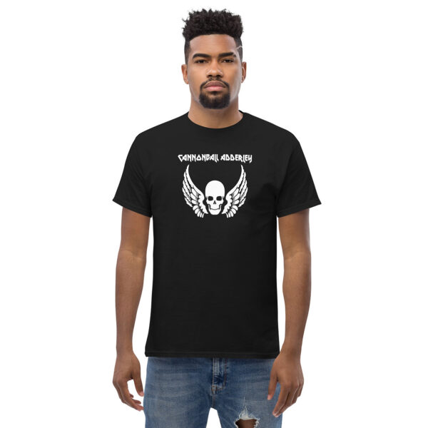 Man facing forward in a black t-shirt with "Cannonball Adderley" and a winged skull graphic printed in white.