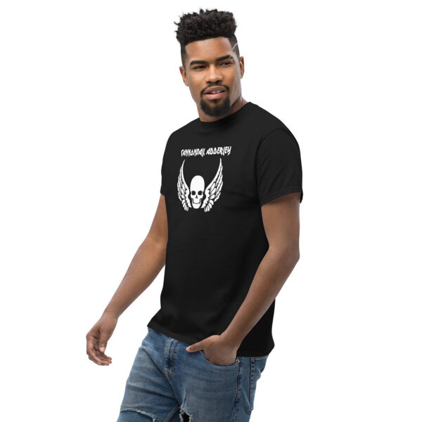 Man wearing a black t-shirt with white "Cannonball Adderley" text and a skull with wings design.