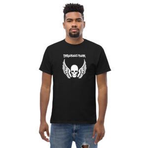 A man wearing a black t-shirt printed with a bold white graphic of a skull with wings, and the words “Thelonious Monk” in a stylized font above the image.
