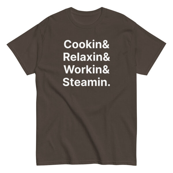 Dark brown t-shirt with large white stacked text reading “Cookin& Relaxin& Workin& Steamin.” in bold sans-serif font.