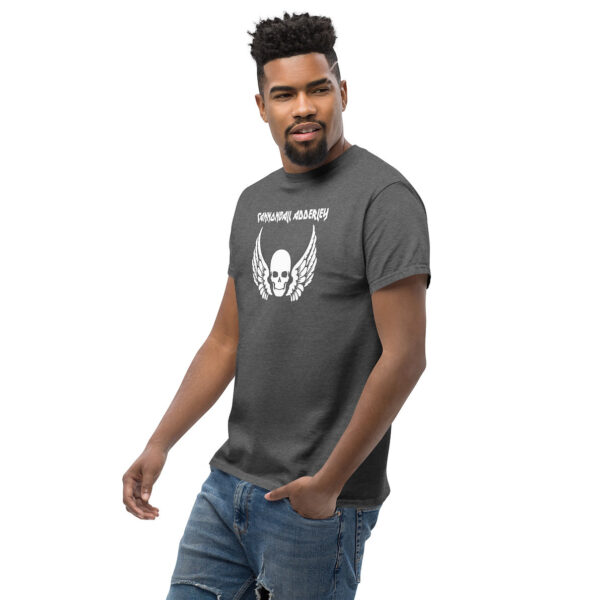 Side-view of model in charcoal heather Cannonball Adderley graphic tee, showcasing the white skull and wing emblem.