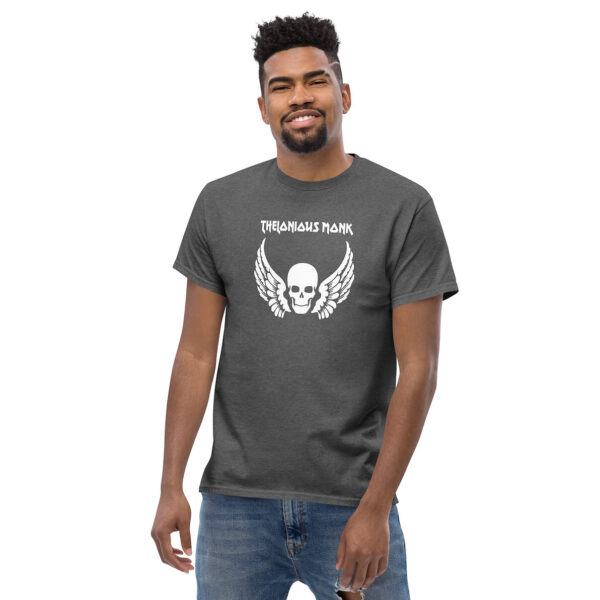 Man smiling in a charcoal heather t-shirt featuring a white winged skull graphic with “Thelonious Monk” text above.