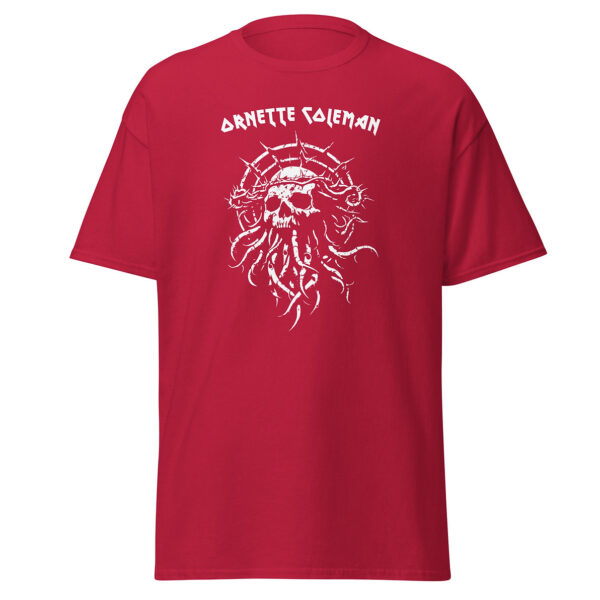 Unisex bright red t-shirt with a bold white illustration of a skull surrounded by spiked vines and tentacle-like shapes, with “Ornette Coleman” in angular lettering across the top.