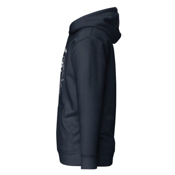 Side view of a navy unisex hoodie with the curved edge of a thorny skull design barely visible on the front.