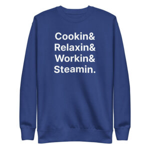 Royal blue crewneck sweatshirt with bold white stacked sans-serif text that reads: “Cookin& Relaxin& Workin& Steamin.”