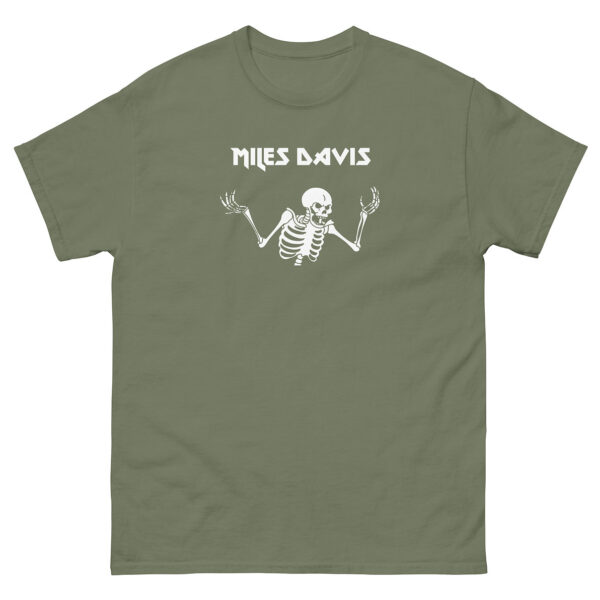 Sage green unisex t-shirt with a white design showing a shrugging skeleton beneath the name “Miles Davis” in a stylized, sharp-edged font.