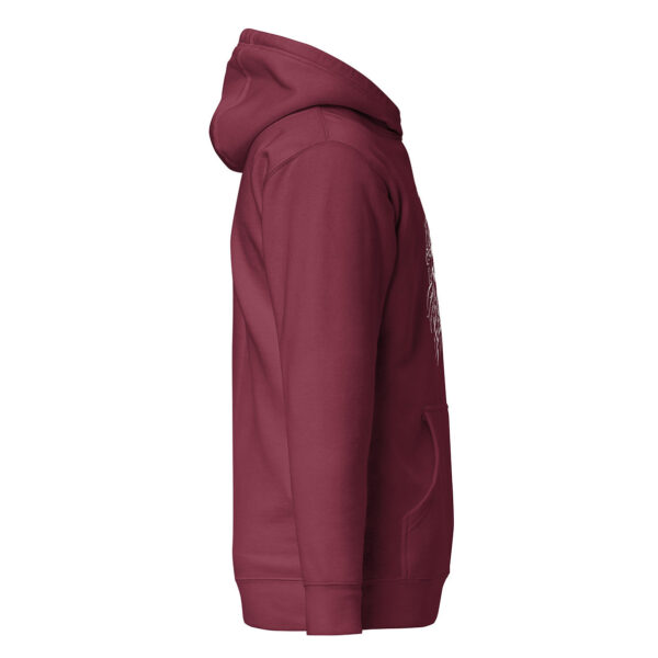 Side view of a maroon unisex hoodie showing the white edge of a skull and spiky tentacle graphic extending from the front.