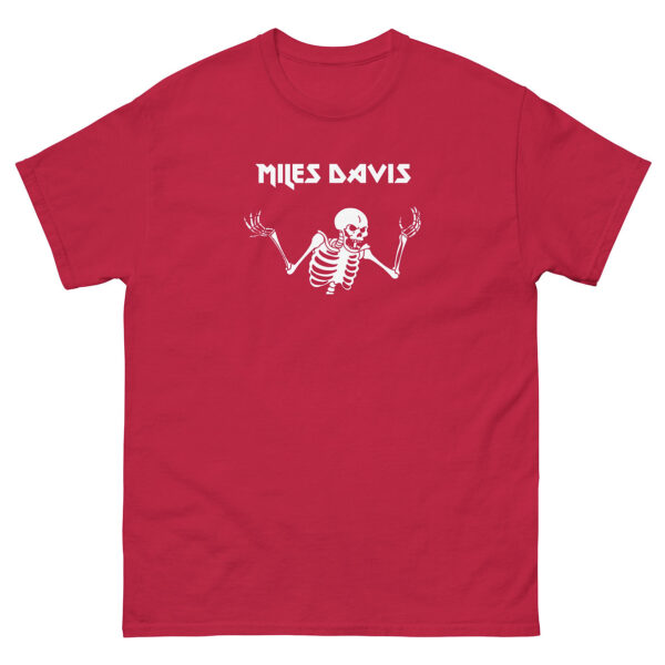 Red unisex t-shirt with a white illustration of a shrugging skeleton and the name “Miles Davis” in bold, angular uppercase lettering centered above it.