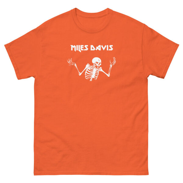 Orange unisex t-shirt featuring a white skeleton shrugging with “Miles Davis” in geometric uppercase letters above.