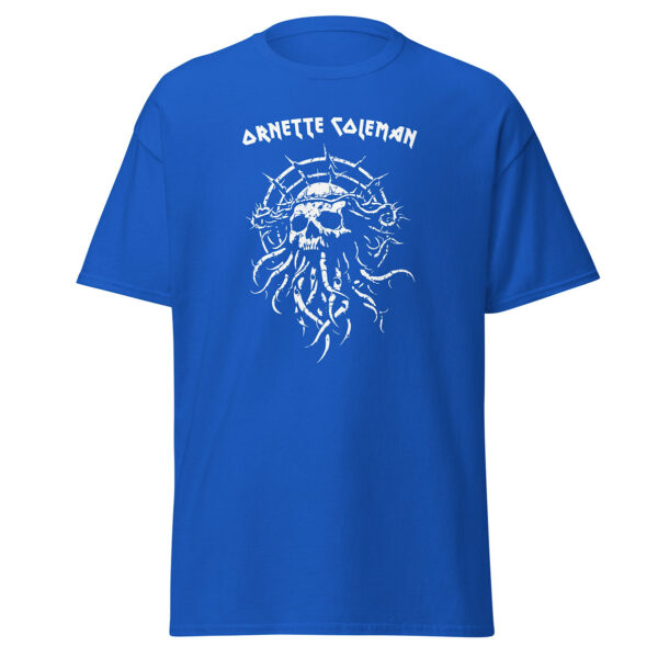Unisex royal blue t-shirt displaying a bold white illustration of a spiky crowned skull with flowing tendrils, centered below the name “Ornette Coleman” in sharp-edged white lettering.
