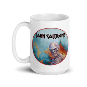 Front view of a white ceramic mug fully displaying a circular artwork of a zombie-like skeletal figure with glowing eyes and flaming background, under “John Coltrane” in sharp black metal lettering.