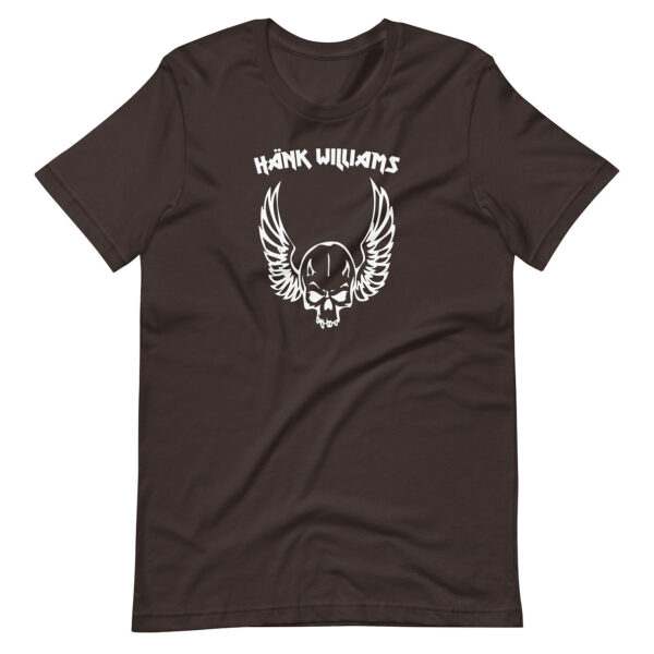 Dark brown t-shirt featuring white graphic of a winged skull with the text “Hank Williams” in a heavy metal-inspired font