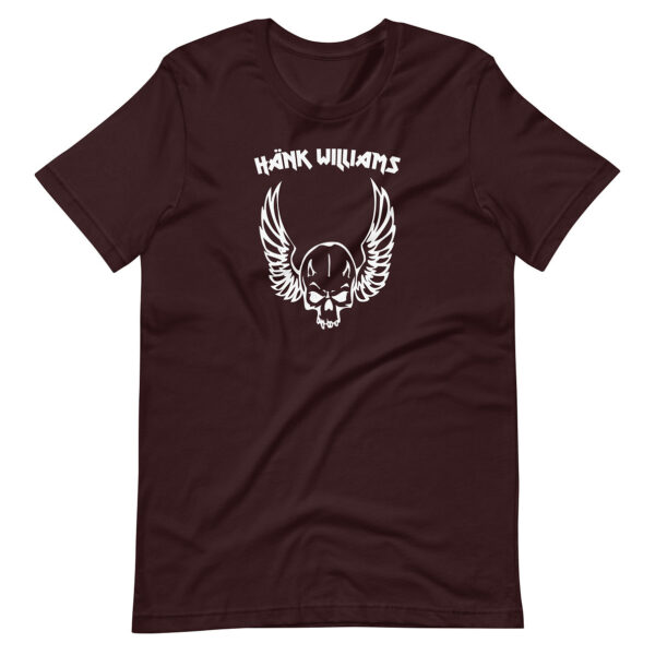 Maroon t-shirt showing a bold white illustration of a skull with wings and “Hank Williams” logo centered at the top