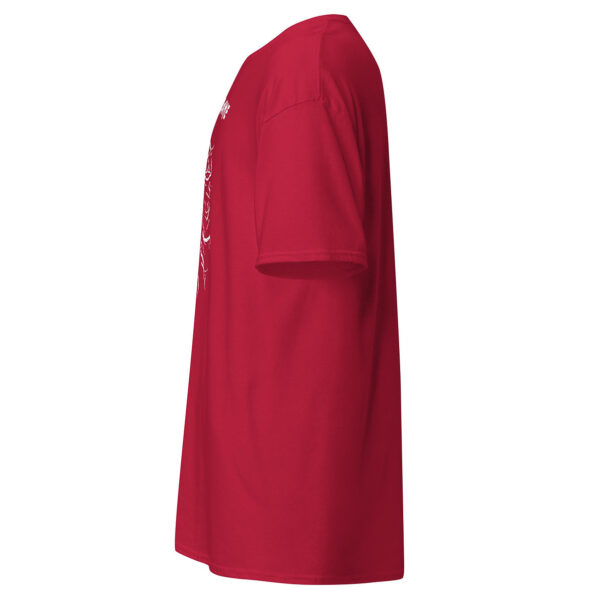 Side view of a red t-shirt showing part of the white skull-and-thorns design with text, sleeve seam and shirt length visible.