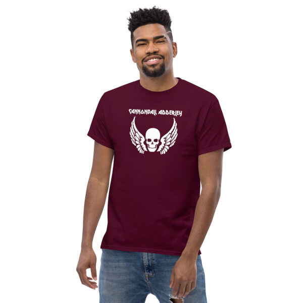 T-shirt in maroon with the name “Cannonball Adderley” in a jagged white font above a white skull with large outstretched wings.