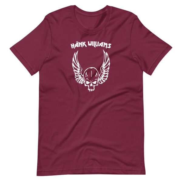 Wine-red t-shirt with a centered white graphic of a winged skull and “Hank Williams” text in angular lettering
