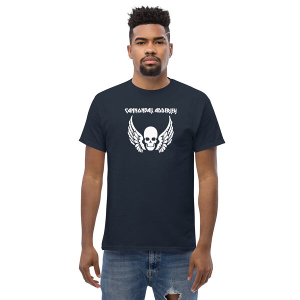 Man standing in a navy t-shirt featuring a white skull with wings design and "Cannonball Adderley" text.