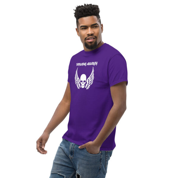Man wearing a purple t-shirt with "Cannonball Adderley" text and a white skull with wings graphic on the chest.
