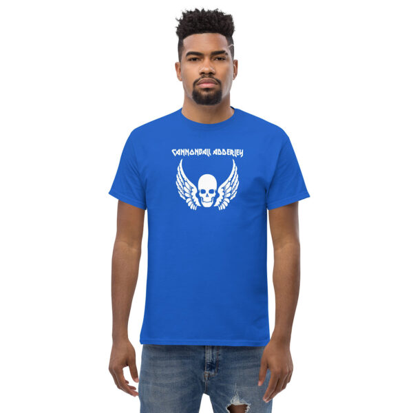 Front view of a man in a royal blue t-shirt displaying a white winged skull graphic with the text “CANNONBALL ADDERLEY” above.
