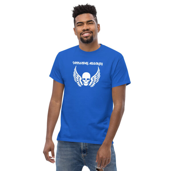 Front view of a man wearing a bright blue t-shirt with a white winged skull graphic and “Cannonball Adderley” in stylized text.