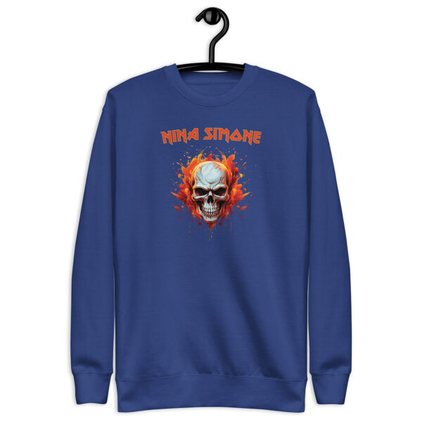 Royal blue crewneck sweatshirt on hanger with a flaming skull graphic and the text “NINA SIMONE” in orange, in a bold, rock-style font.