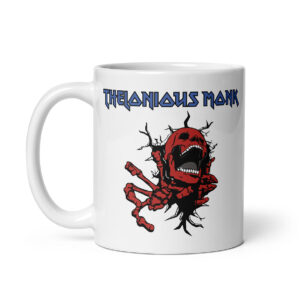 White ceramic mug featuring a graphic of a red skeleton bursting through a surface beneath the text “Thelonious Monk” in a sharp, heavy metal-style blue font.