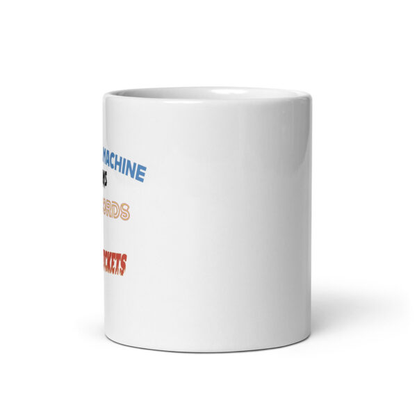 Side view of a white ceramic mug showing the edge of colorful text wrapping around, with partial words "MACHINE," "RECORDS," and "TICKETS" visible in different fonts and colors.