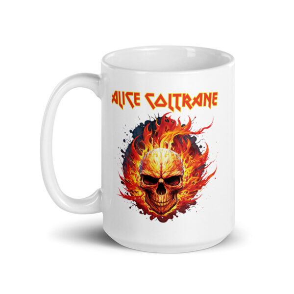 White ceramic mug featuring a flaming skull illustration with red, orange, and yellow fire surrounding the head, and the text “Alice Coltrane” above it in bold, angular red-and-yellow font.