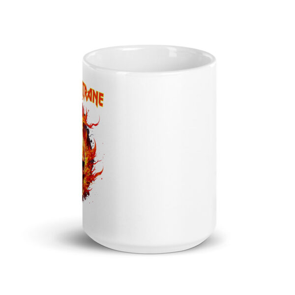 White ceramic mug with partial view of a flaming skull graphic and bold yellow-and-red text reading "John Coltrane" wrapping around the design.
