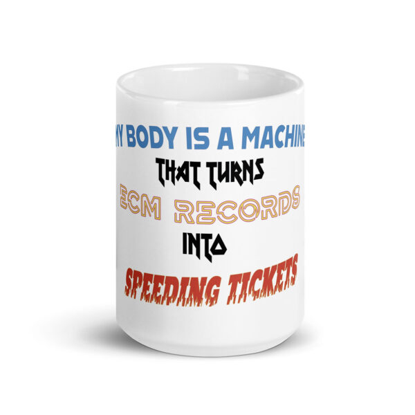 White ceramic mug with bold, colorful typography that reads: "My body is a machine that turns ECM Records into speeding tickets," with each phrase in a distinct font style and color.