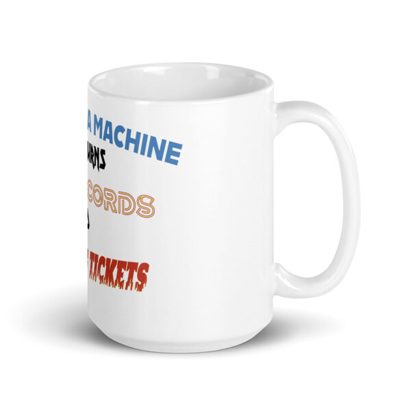 White ceramic mug featuring staggered multicolored text in various fonts, including phrases like "A MACHINE," "RECORDS," and "TICKETS," displayed on the side of the mug.