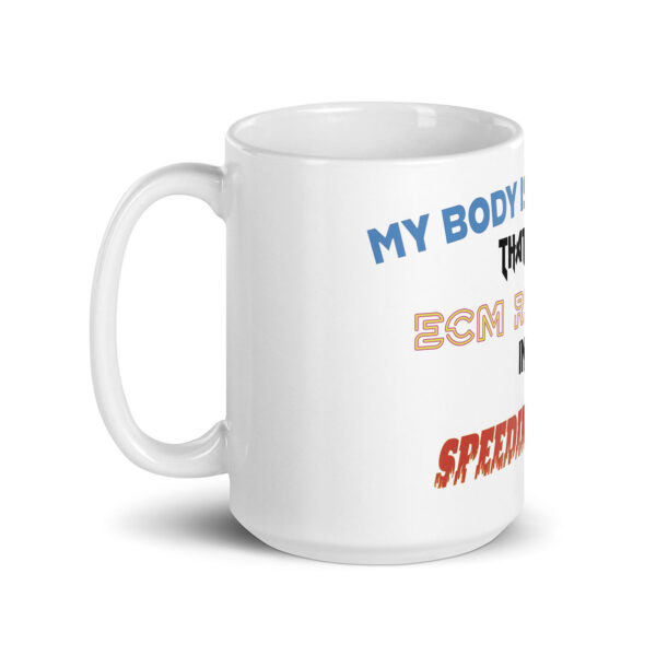 White ceramic mug with multicolored, stylized text that begins with "MY BODY IS" in blue, followed by various other bold and decorative fonts partially visible on the right side of the mug.