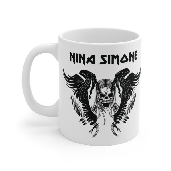 White ceramic mug featuring a black gothic-style illustration of a skull with wings and long hair, with the text "Nina Simone" in a bold heavy-metal font above the design
