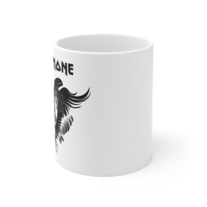 Side angle view of a white ceramic mug featuring a partial black gothic-style illustration of a winged skull with long hair and the text "Nina Simone" partially visible at the top