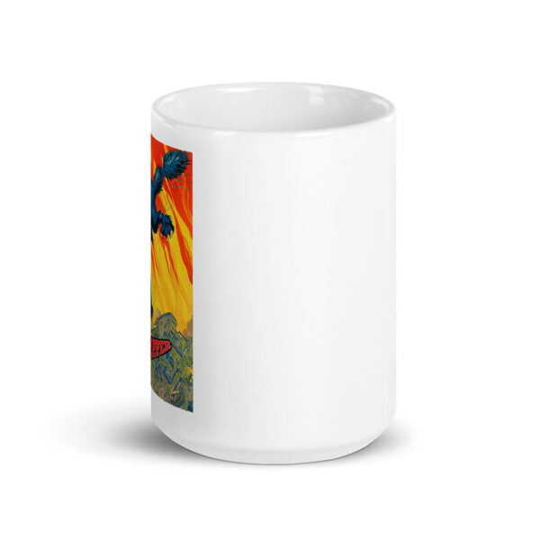 White ceramic mug featuring a colorful comic-style illustration of a giant blue cat leaping through flames, with the text Cat Popper visible near the bottom of the design.
