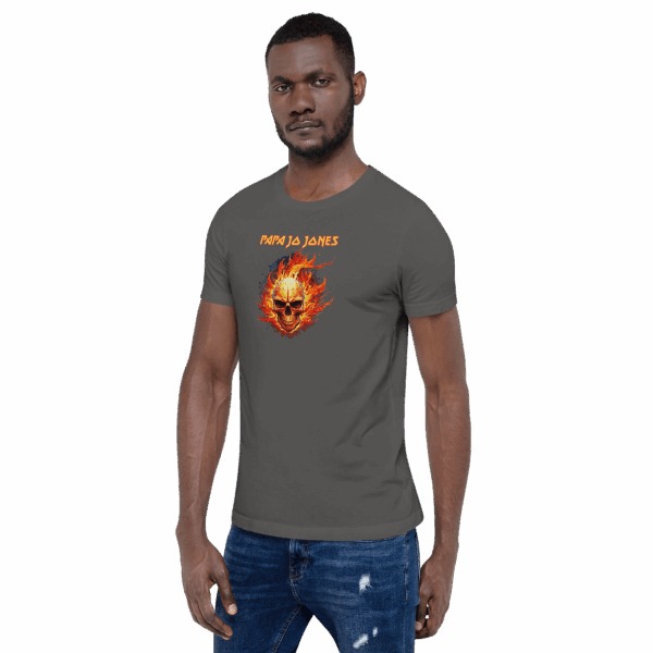 Man standing in the same gray shirt with the flaming skull design, turned slightly right.