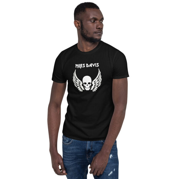 Front view of a black men’s fitted T-shirt featuring the same skull and wings design and "Miles Davis" text; the model is looking off to the side.
