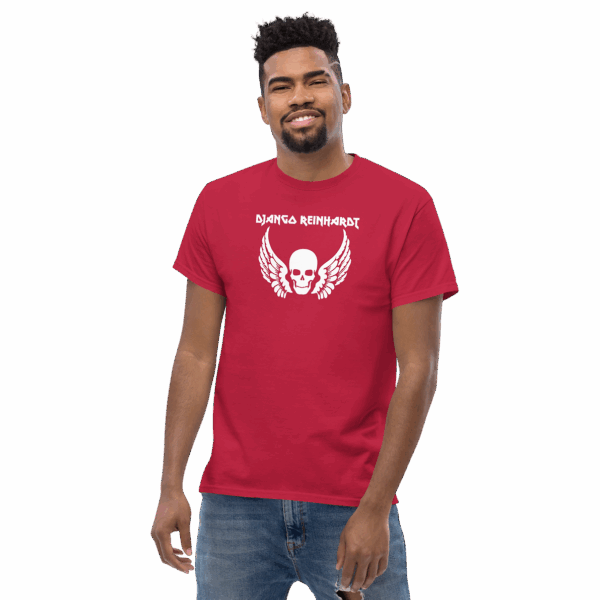 Django Reinhardt tribute t-shirt in vibrant red, featuring a white winged skull graphic and bold uppercase name text, modeled at a slight angle, smiling.