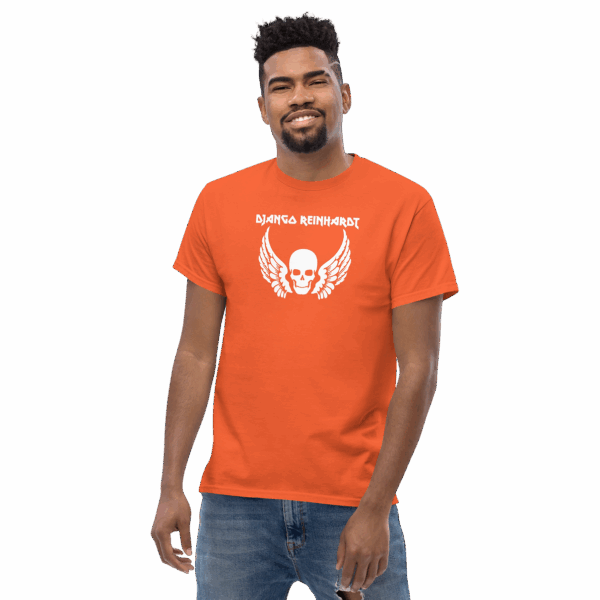 Model wearing an orange t-shirt with a white “Django Reinhardt” skull and wings graphic, smiling.
