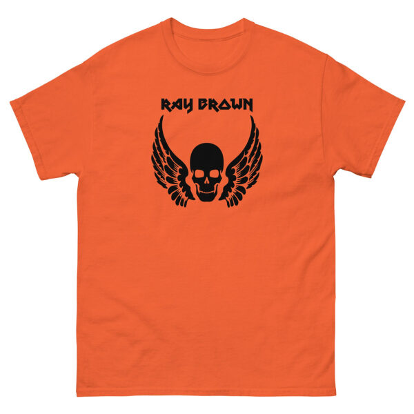 Orange unisex tee, front view featuring the same black skull and wing graphic with text.