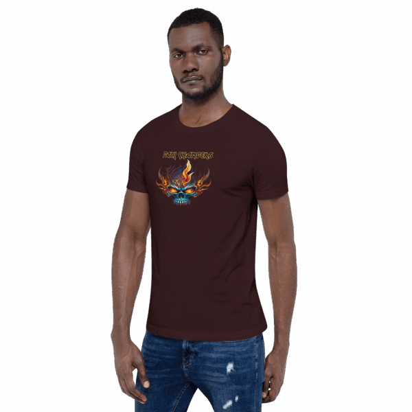 Man standing in a maroon graphic t-shirt with “PAUL CHAMBERS” text and a flaming skull graphic, facing forward with arms at his sides.