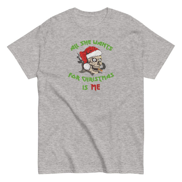 Heather gray unisex T-shirt featuring a graphic of a grinning skull in a Santa hat with a cigar in its mouth, surrounded by green and red text that reads “All She Wants for Christmas Is Me” in a bold, edgy font.