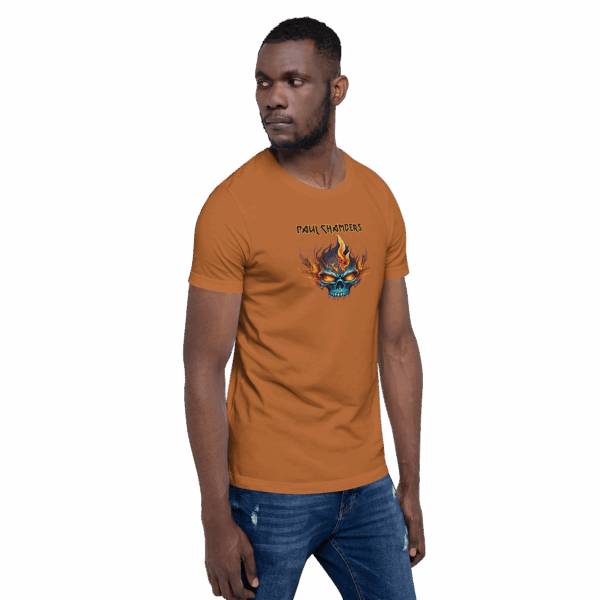 Man wearing an orange-brown t-shirt with a flaming skull graphic and “Paul Chambers” text, standing in a three-quarter pose looking to the side.