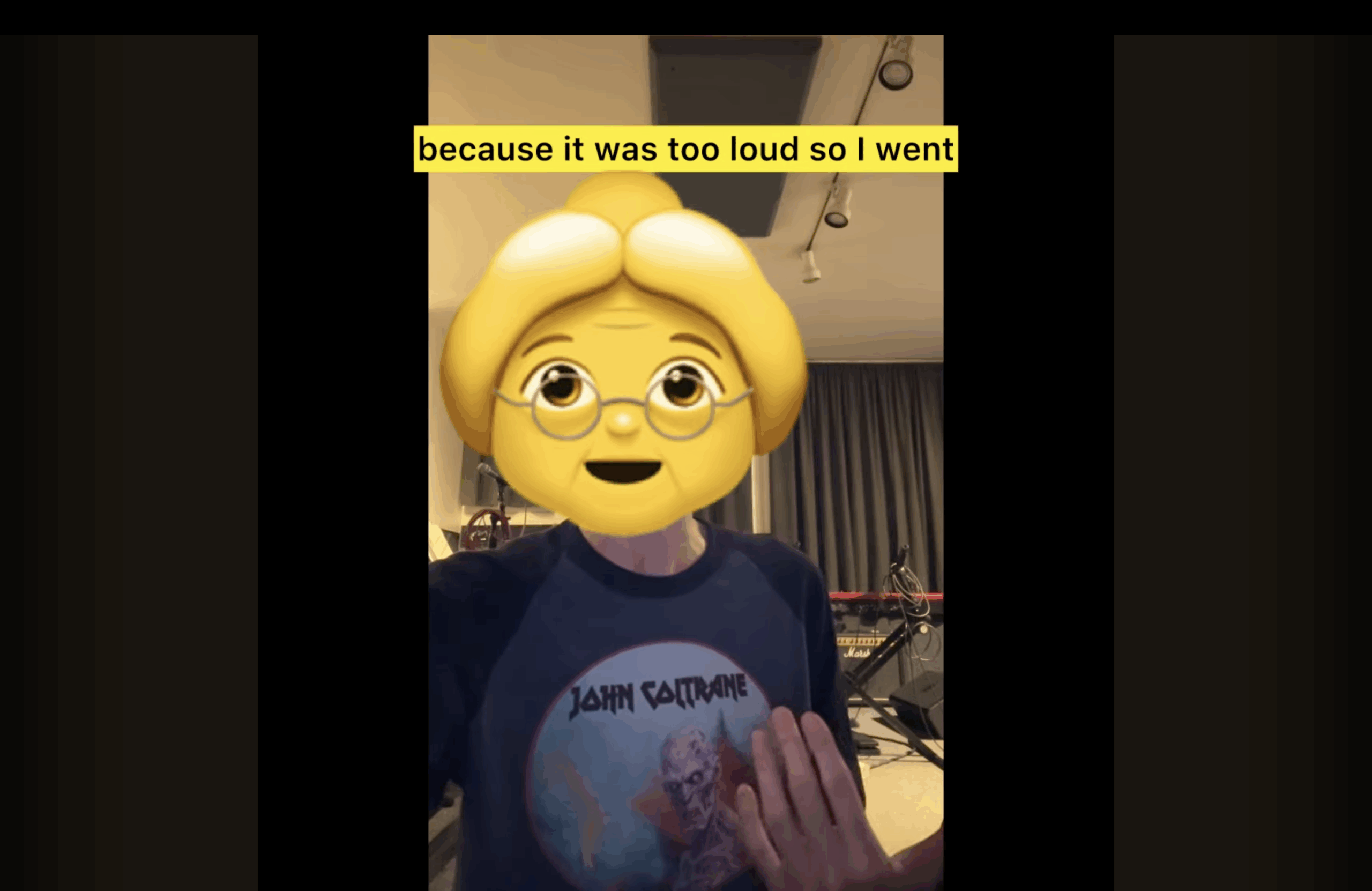 Cat Popper with older woman emoji with hair styled in a bun and wearing glasses over her real face.